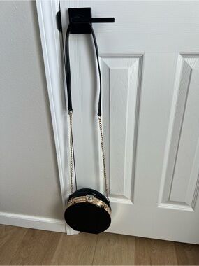 Black Round Crossbody Bag with Gold Trim